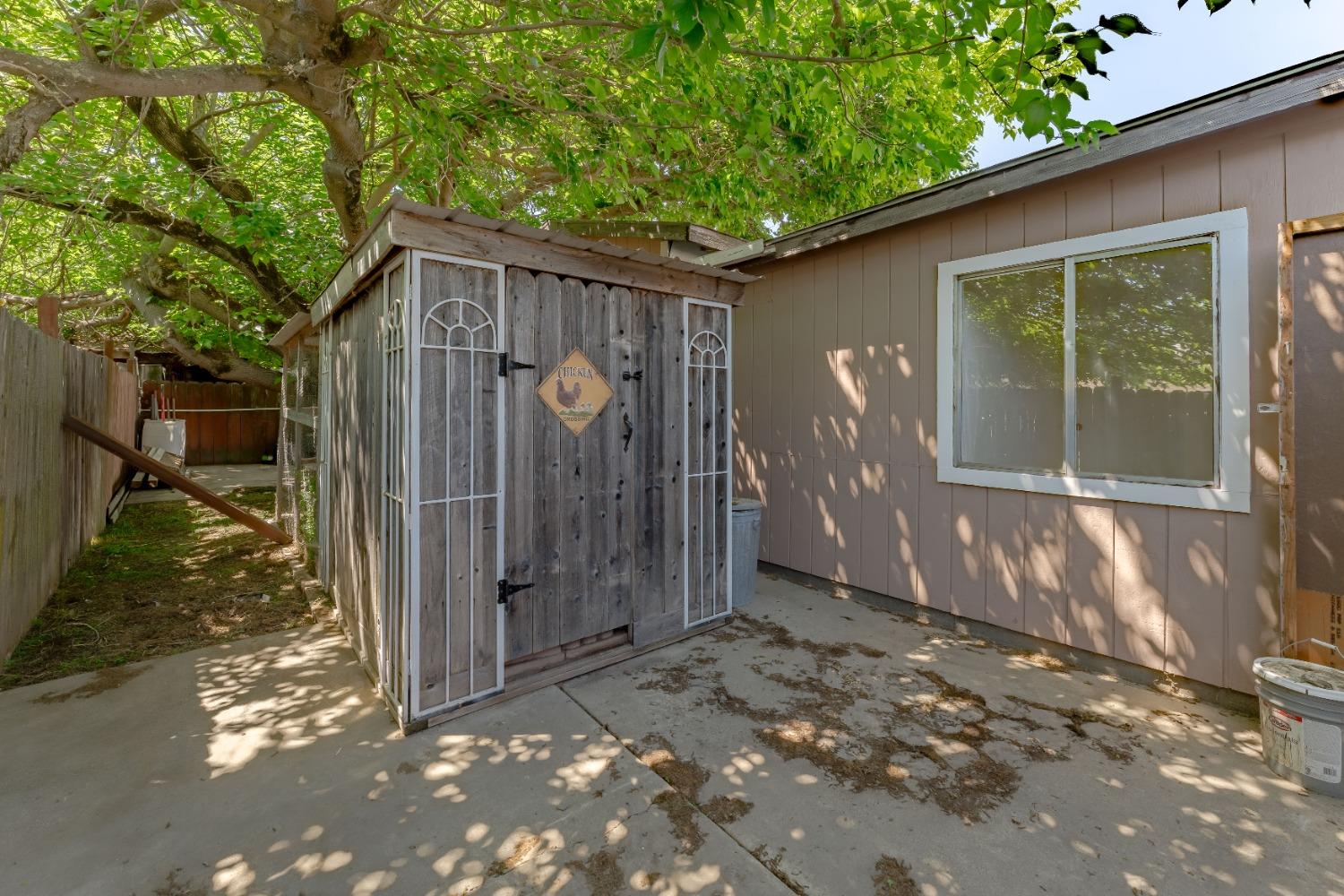 6849 26th Street Rio Linda, CA 95673 - Photo 34 of 56 a backyard of a house with barbeque oven and glass door