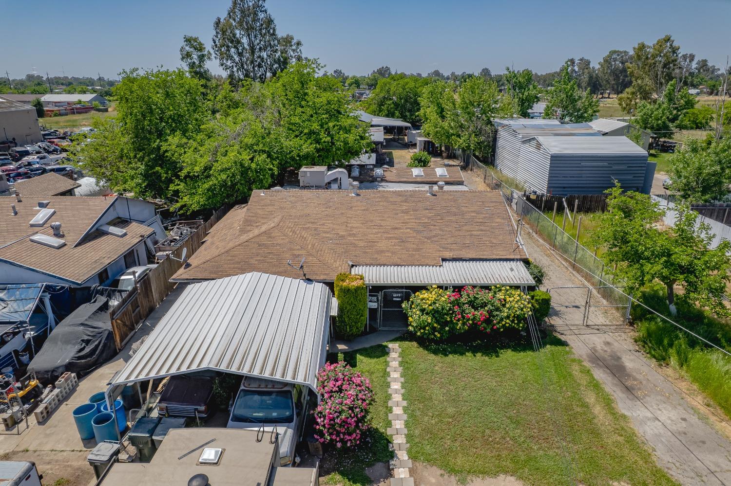6849 26th Street Rio Linda, CA 95673 - Photo 46 of 56 an aerial view of a house with a yard and garden