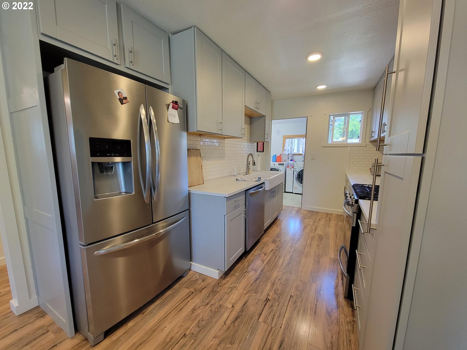 678 2nd Avenue Riddle, OR 97469 - Photo 6 of 23 a kitchen with stainless steel appliances a refrigerator a sink a stove and cabinets