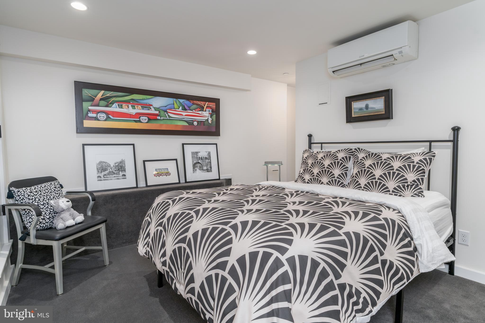 1737 Church Street Northwest Washington, DC 20036 - Photo 18 of 58 a bedroom with a bed and glass window