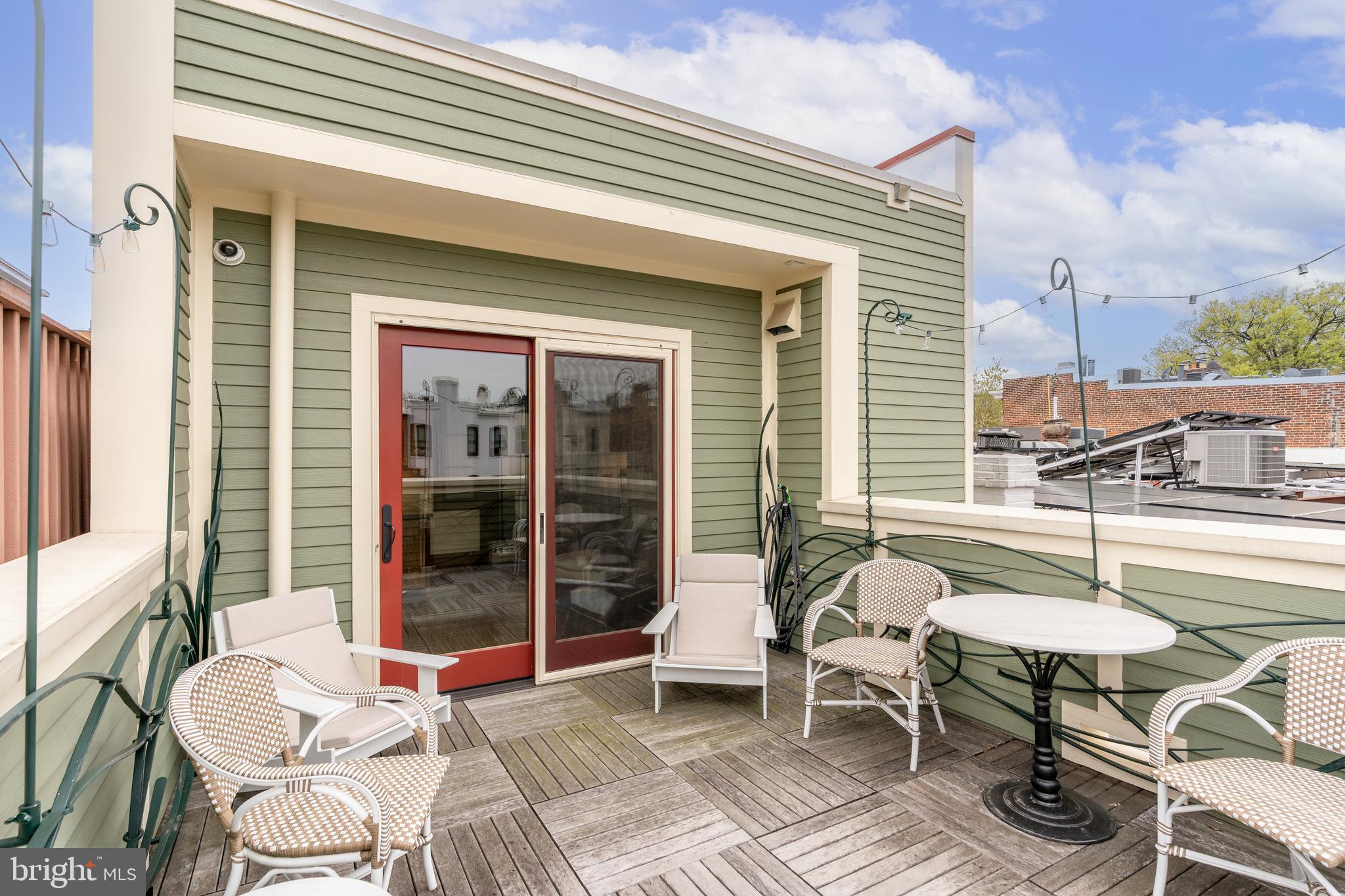1737 Church Street Northwest Washington, DC 20036 - Photo 46 of 58 a balcony with table and chairs
