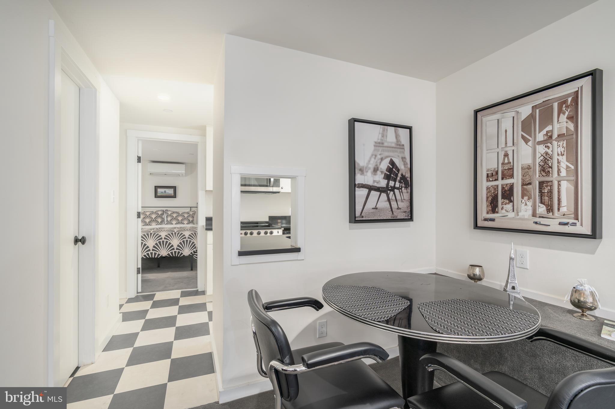 1737 Church Street Northwest Washington, DC 20036 - Photo 51 of 58 a view of a dining room with furniture and wooden floor