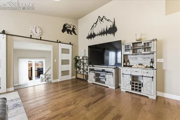 a view of living room with furniture and flat screen tv