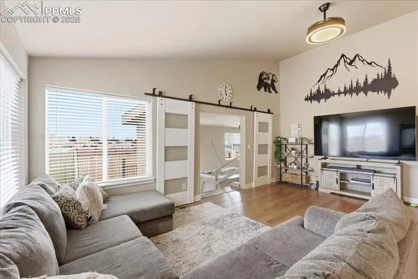 a living room with furniture and a flat screen tv