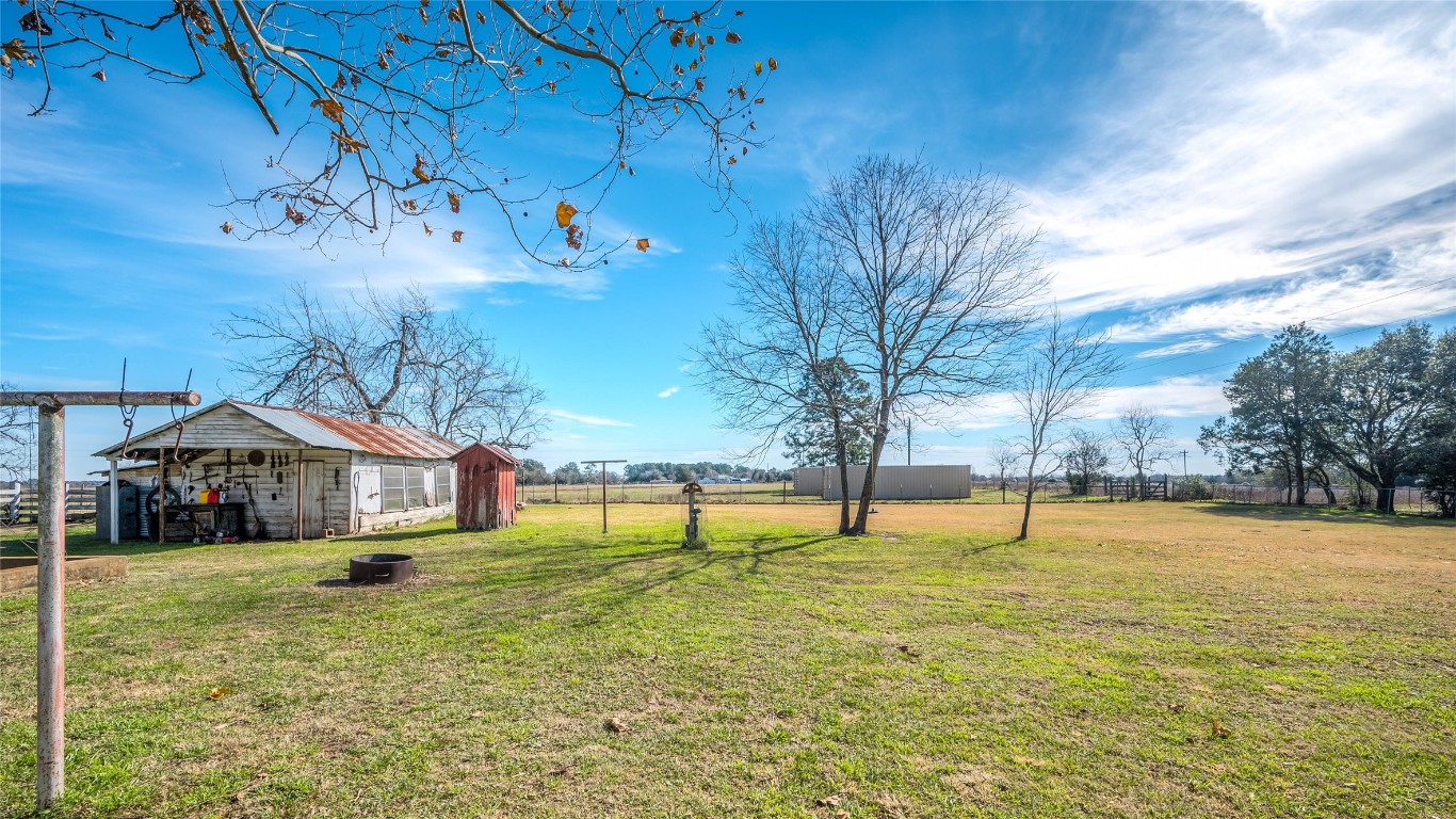 10152 Farm To Market Road 949 Cat Spring, TX 78933 - Photo 12 of 45 a front view of a house with a yard
