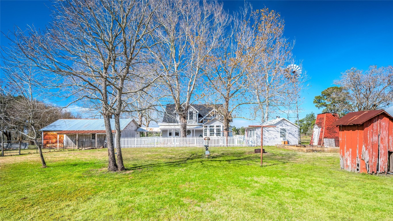 10152 Farm To Market Road 949 Cat Spring, TX 78933 - Photo 16 of 45 a view of a park with swings and a bench