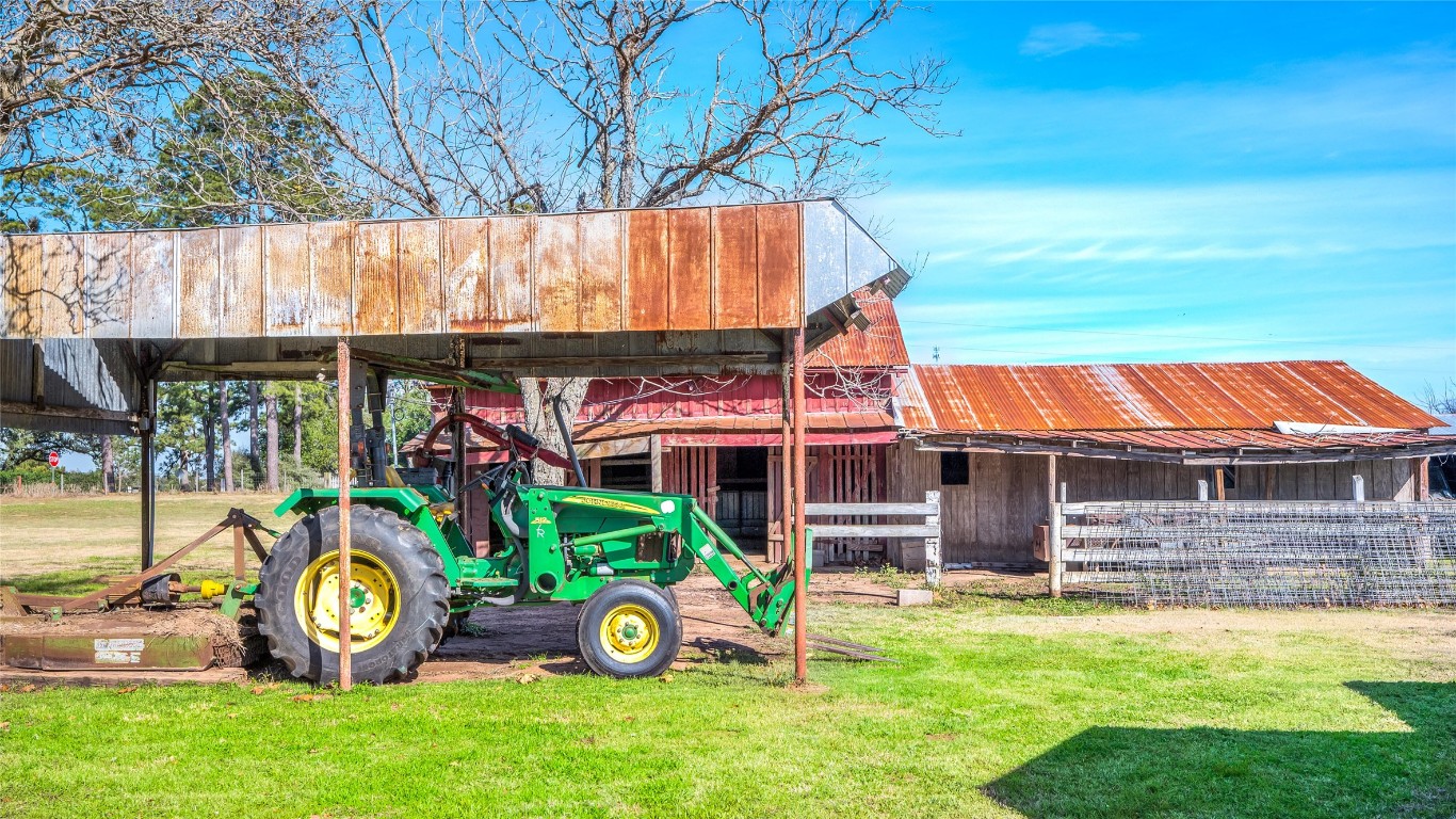 10152 Farm To Market Road 949 Cat Spring, TX 78933 - Photo 17 of 45 a front view of a house with garden