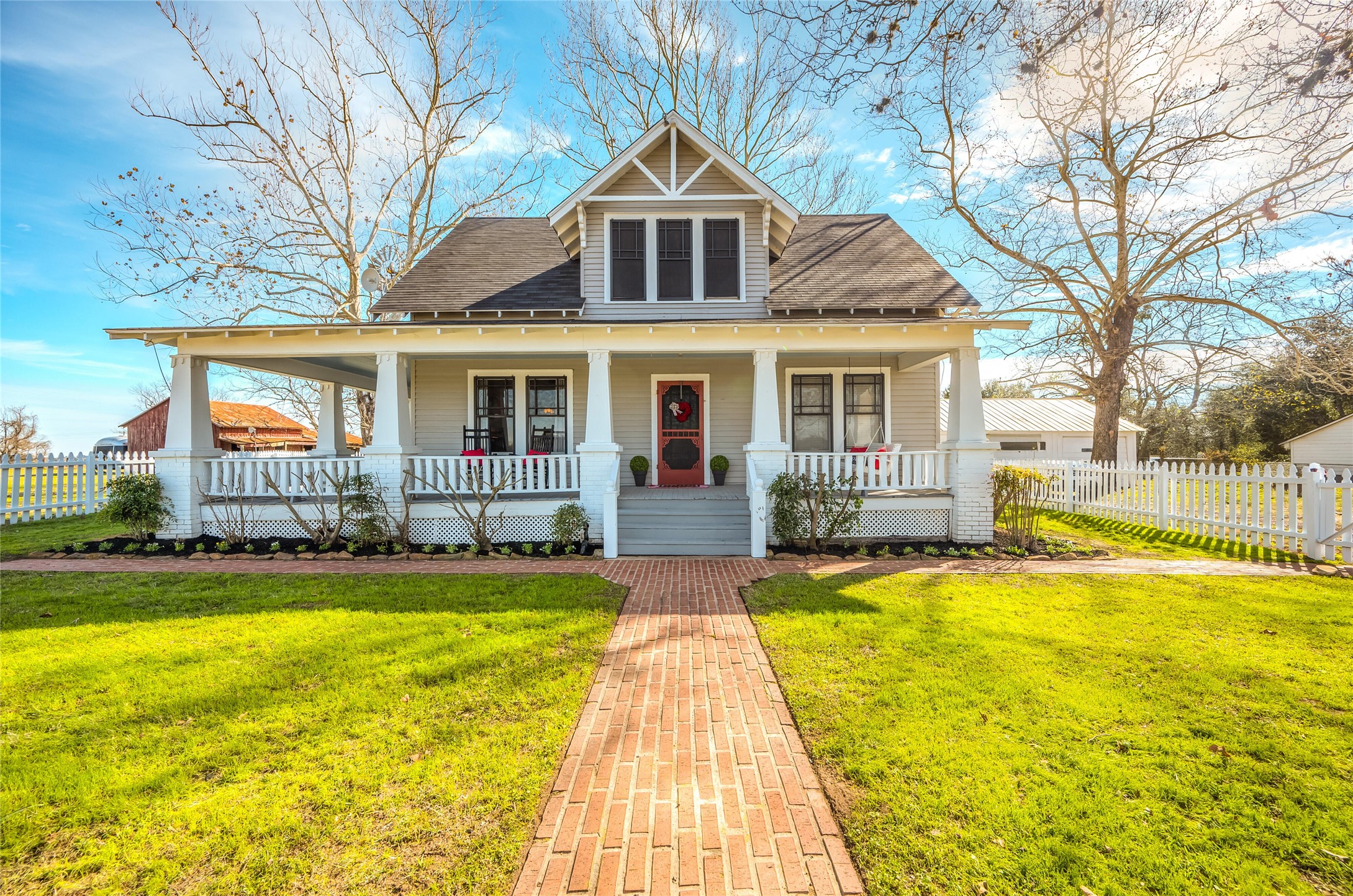 10152 Farm To Market Road 949 Cat Spring, TX 78933 - Photo 2 of 45 a front view of house with swimming pool and seating space