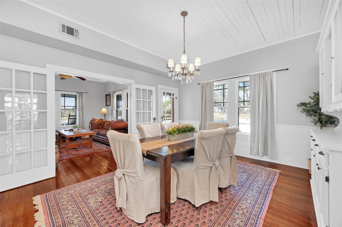 10152 Farm To Market Road 949 Cat Spring, TX 78933 - Photo 22 of 45 a living room with furniture and a chandelier