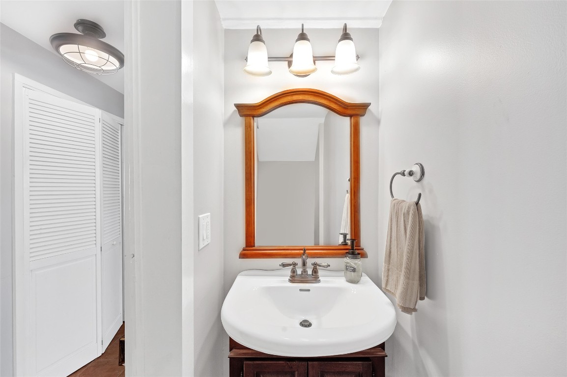 10152 Farm To Market Road 949 Cat Spring, TX 78933 - Photo 33 of 45 a bathroom with a sink and a mirror