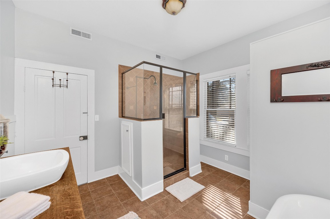 10152 Farm To Market Road 949 Cat Spring, TX 78933 - Photo 37 of 45 a spacious bedroom with a bed and a window