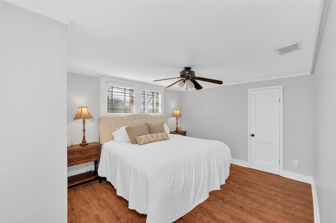 10152 Farm To Market Road 949 Cat Spring, TX 78933 - Photo 39 of 45 a bedroom with a bed and wooden floor