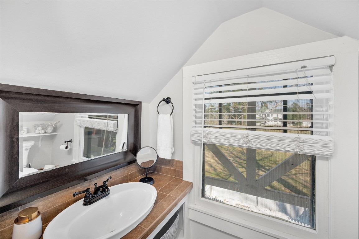 10152 Farm To Market Road 949 Cat Spring, TX 78933 - Photo 43 of 45 a bathroom with a sink mirror and window