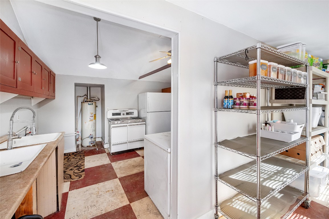 10152 Farm To Market Road 949 Cat Spring, TX 78933 - Photo 45 of 45 a kitchen with stainless steel appliances kitchen island granite countertop a refrigerator and a stove top oven