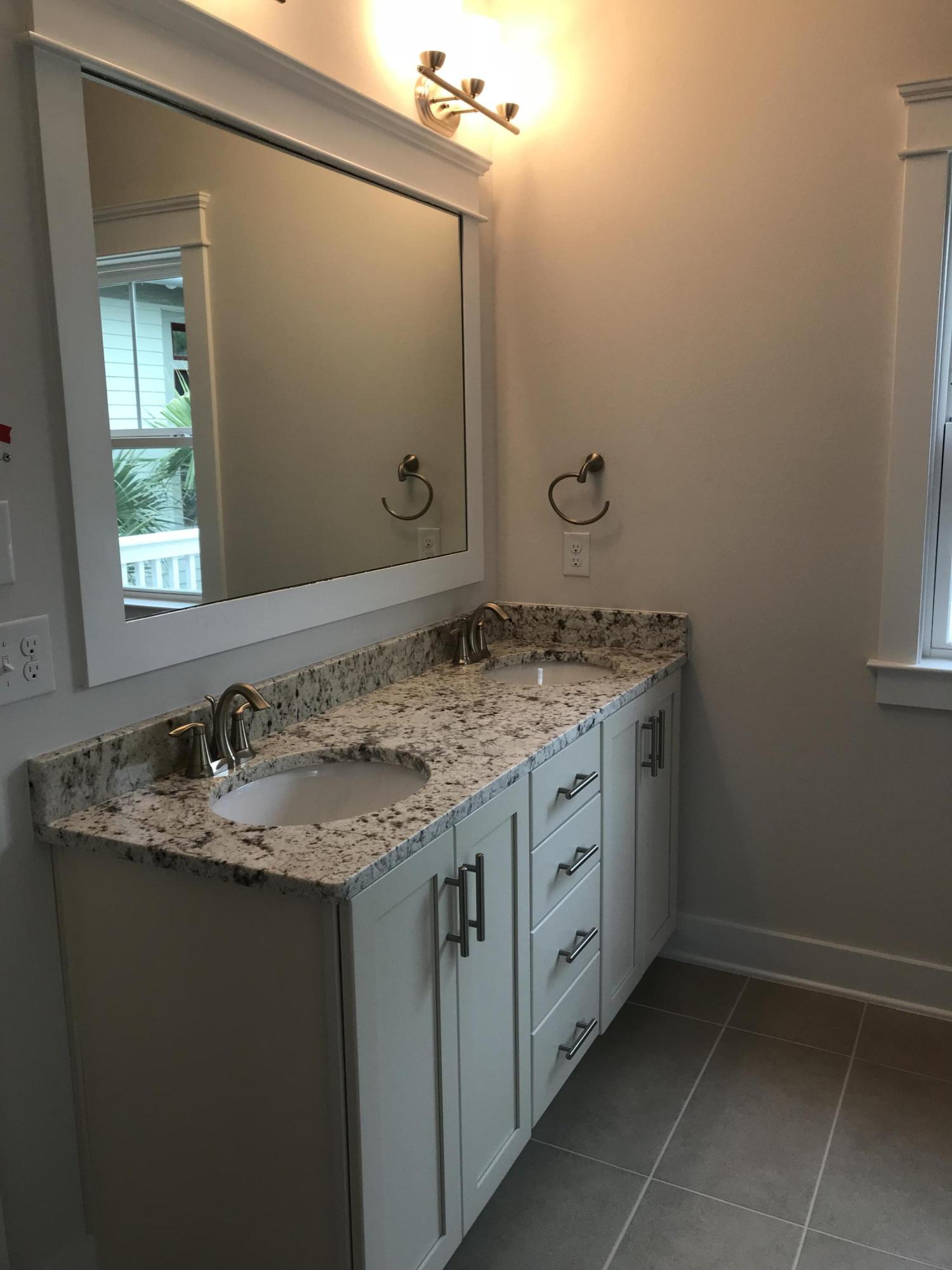 378 Grande Pointe Dr Inlet Beach Inlet Beach, FL 32461 - Photo 11 of 18 a bathroom with a granite countertop sink and a mirror