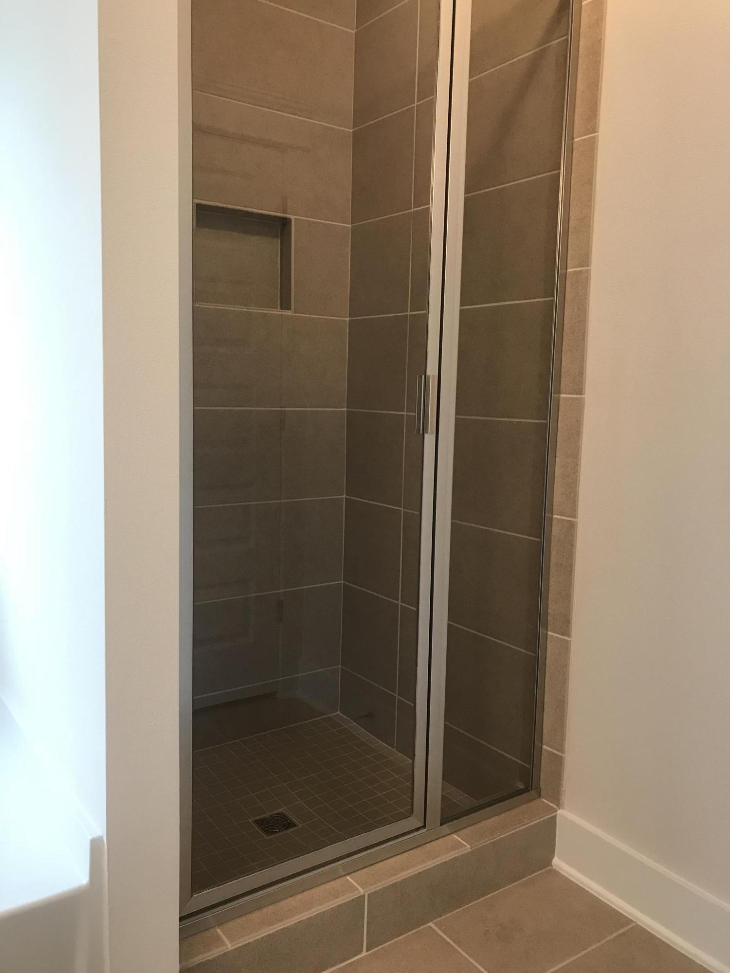 378 Grande Pointe Dr Inlet Beach Inlet Beach, FL 32461 - Photo 13 of 18 a bathroom with a glass shower door