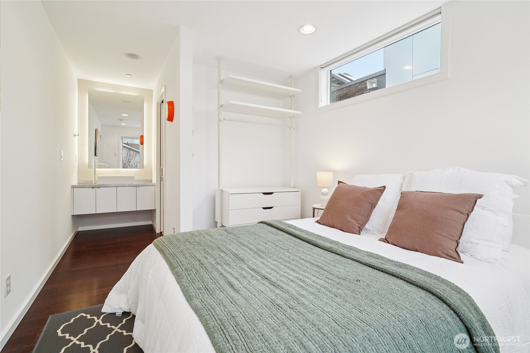 1321 South State Street, Unit C Seattle, WA 98144 - Photo 25 of 36 a bedroom with a bed and a painting on the wall