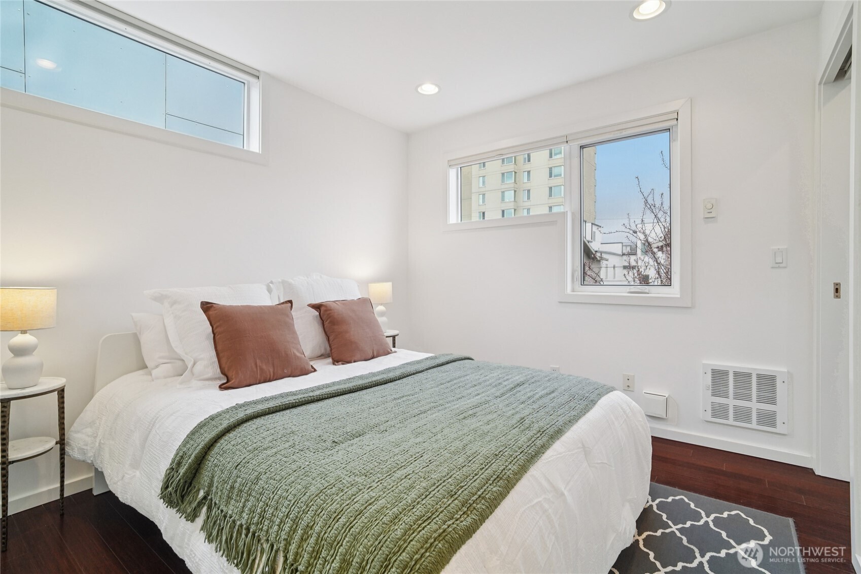 1321 South State Street, Unit C Seattle, WA 98144 - Photo 26 of 36 a bedroom with a large bed and a window