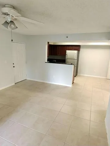a view of an empty room with a bathroom