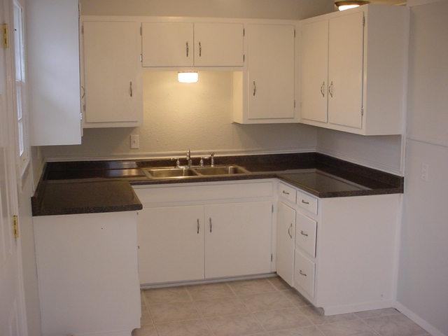 4807 South Bonham Street Amarillo, TX 79110 - Photo 3 of 4 a view of a kitchen with white cabinets