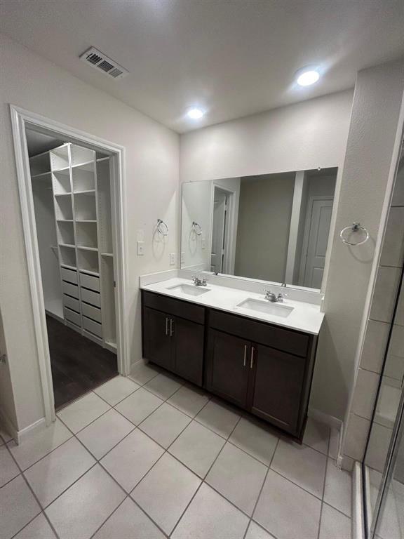 602 Range Drive Princeton, TX 75407 - Photo 10 of 19 a spacious bathroom with a double vanity sink and a mirror