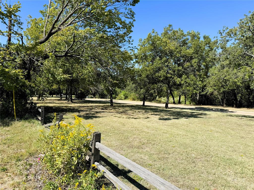 6514 South Cooper Street Arlington, TX 76001 - Photo 3 of 6 a view of swimming pool with trees