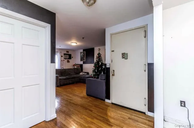 a bedroom with a bed and a flat tv screen