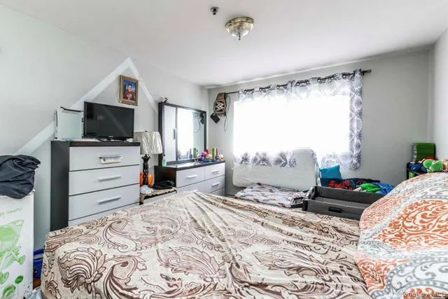 a small bathroom with a sink a toilet and shower curtain