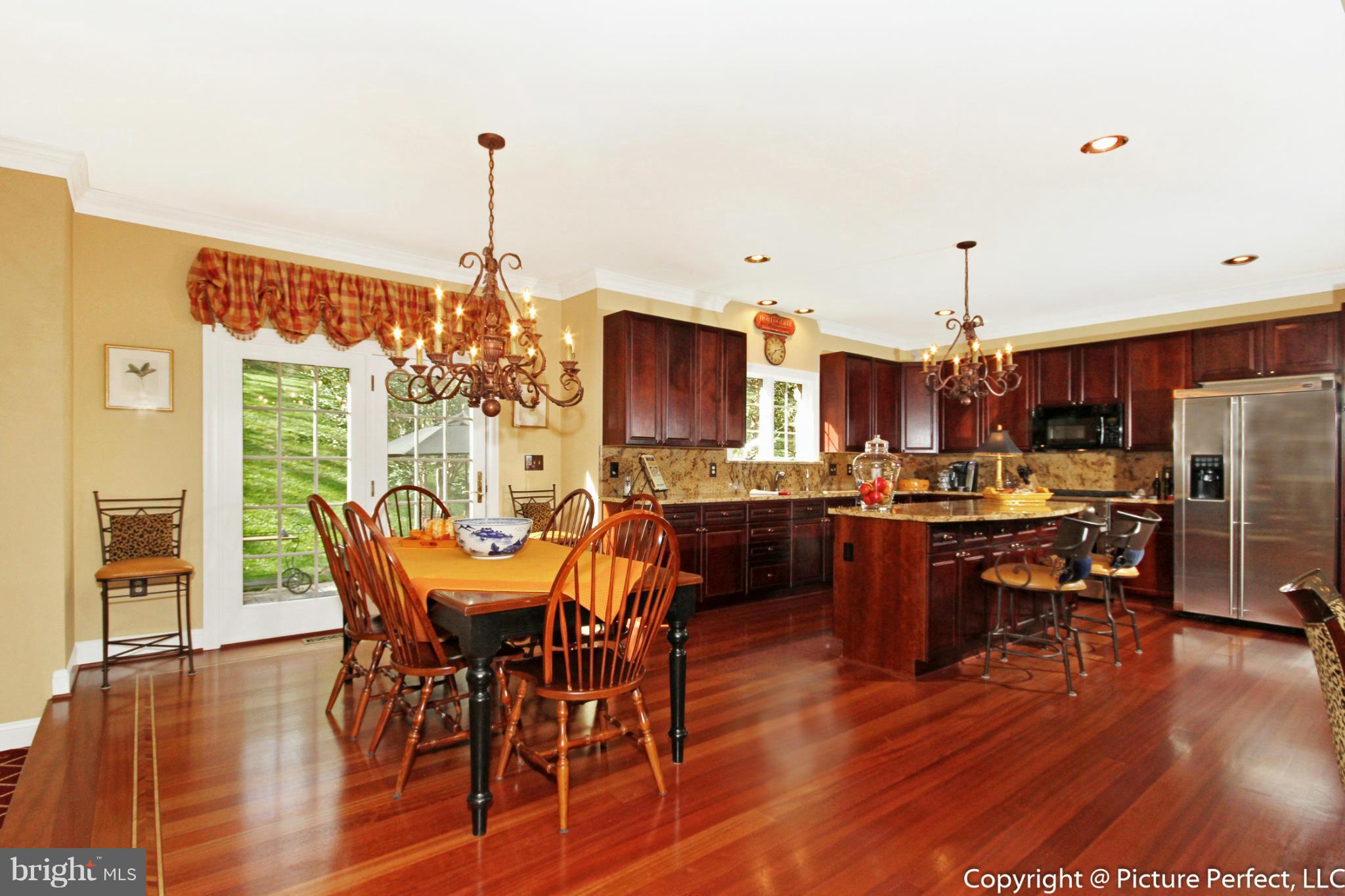 5380 Stone Road Frederick, MD 21703 - Photo 15 of 30 a view of a dining room with furniture window and wooden floor