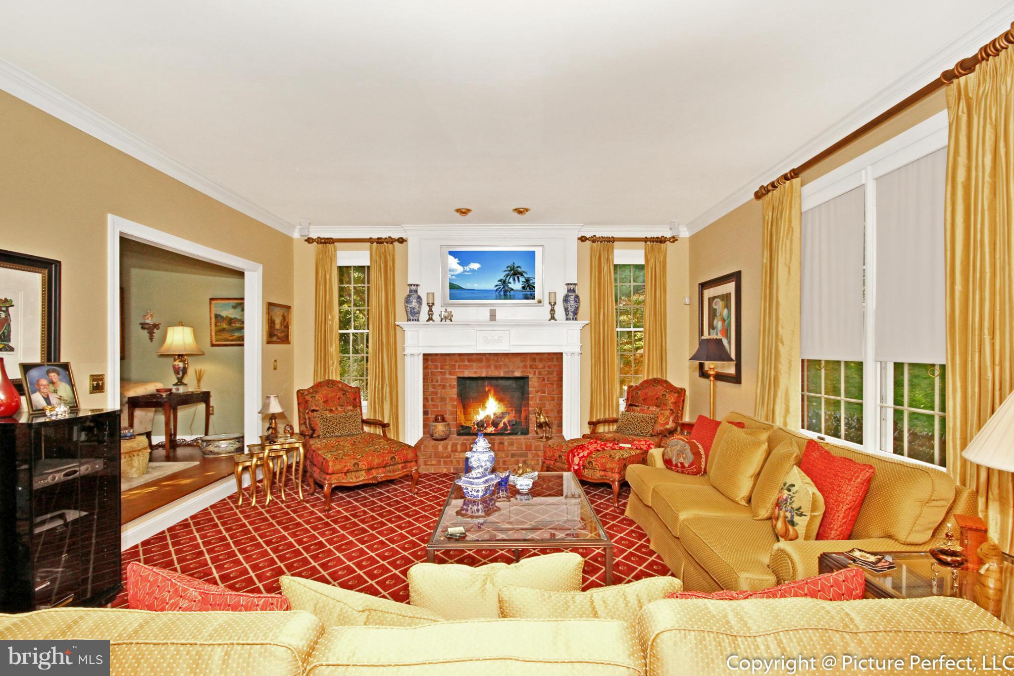 5380 Stone Road Frederick, MD 21703 - Photo 18 of 30 a living room with furniture large window and a fireplace