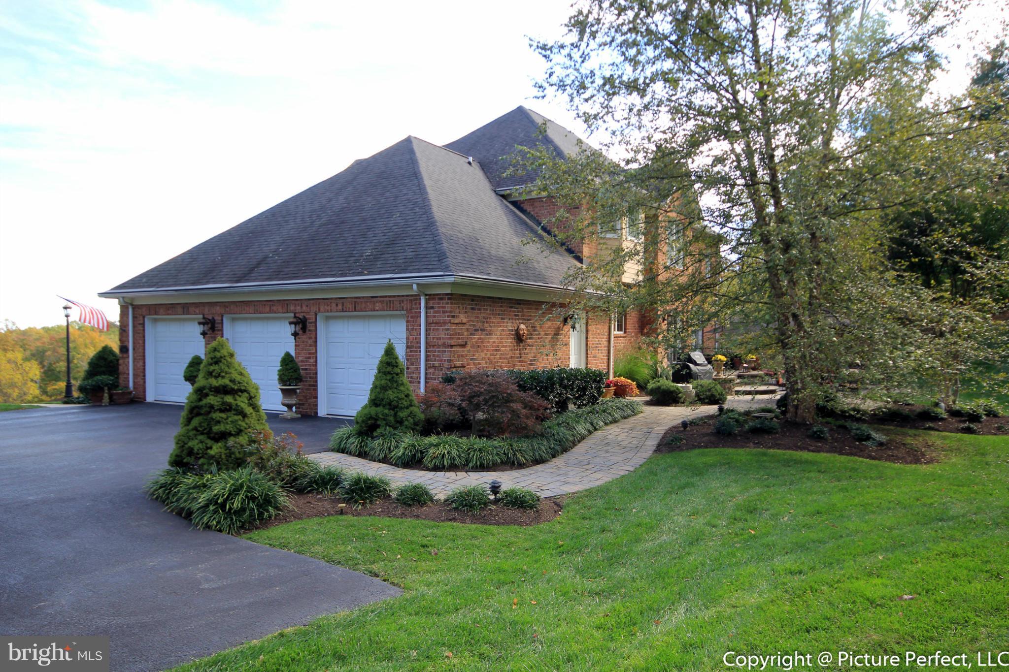 5380 Stone Road Frederick, MD 21703 - Photo 3 of 30 a front view of a house with a yard and outdoor seating