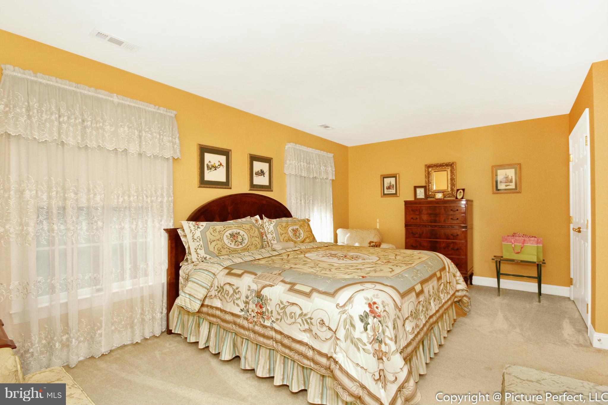 5380 Stone Road Frederick, MD 21703 - Photo 26 of 30 a bedroom with a bed and a cabinets