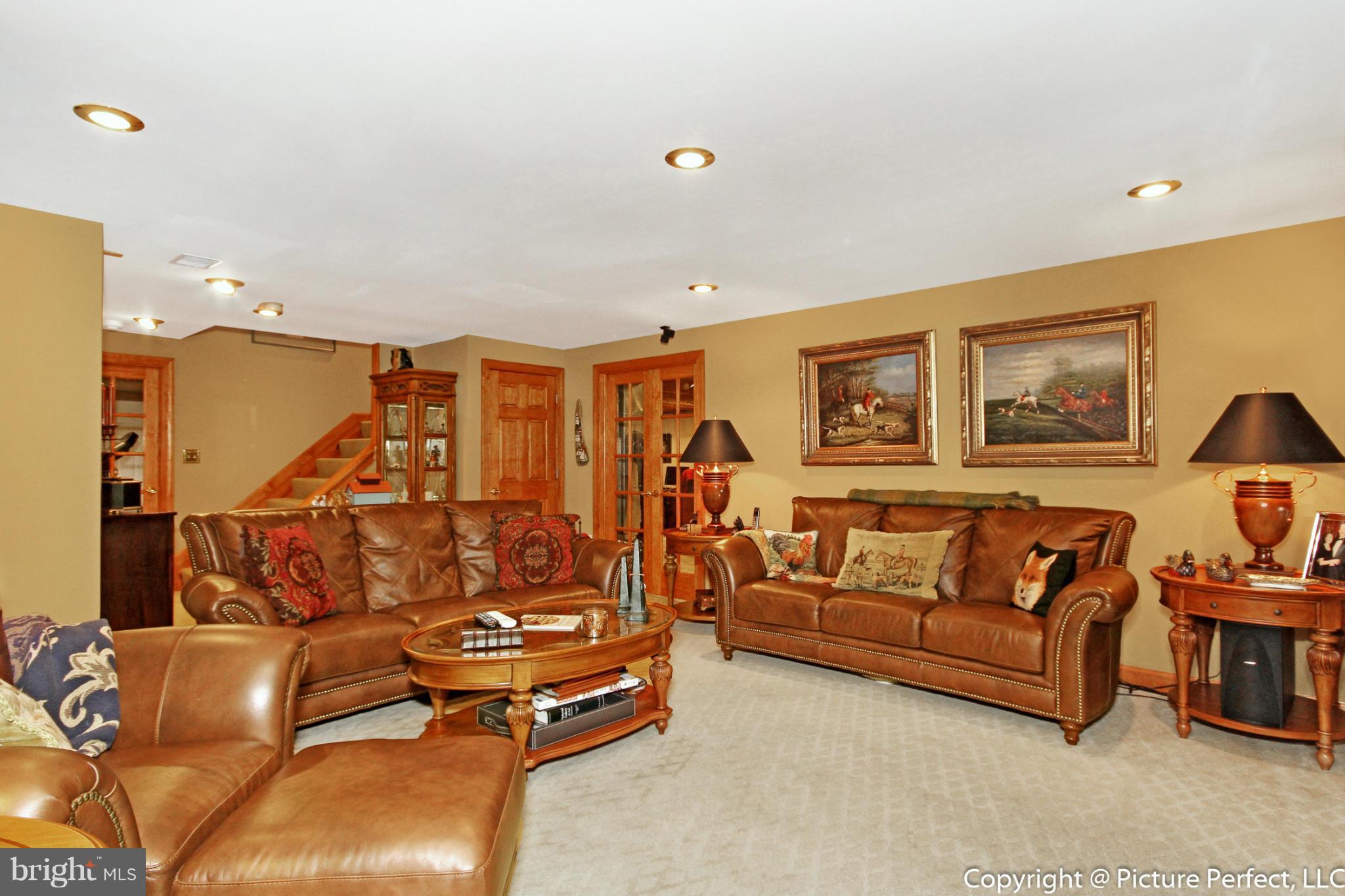 5380 Stone Road Frederick, MD 21703 - Photo 29 of 30 a living room with furniture and a flat screen tv