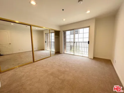 a view of storage and utility room with washer and dryer
