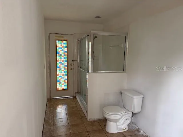 a bathroom with a toilet and a sink