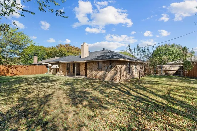 a view of a house with a big yard
