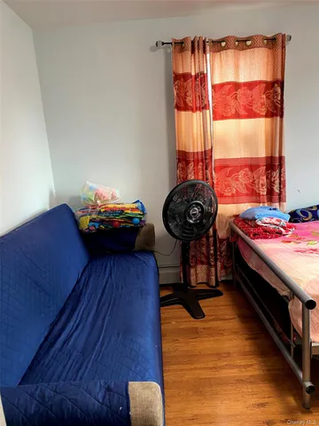 a bedroom with a bed and a closet