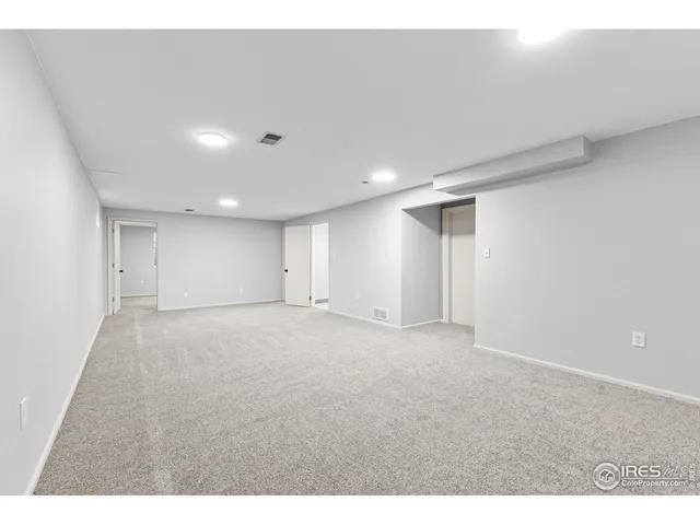 a bathroom with a sink a toilet a shower and a mirror