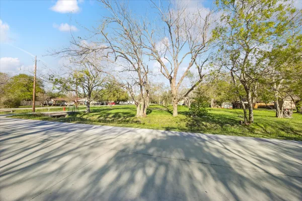 a view of yard with swimming pool