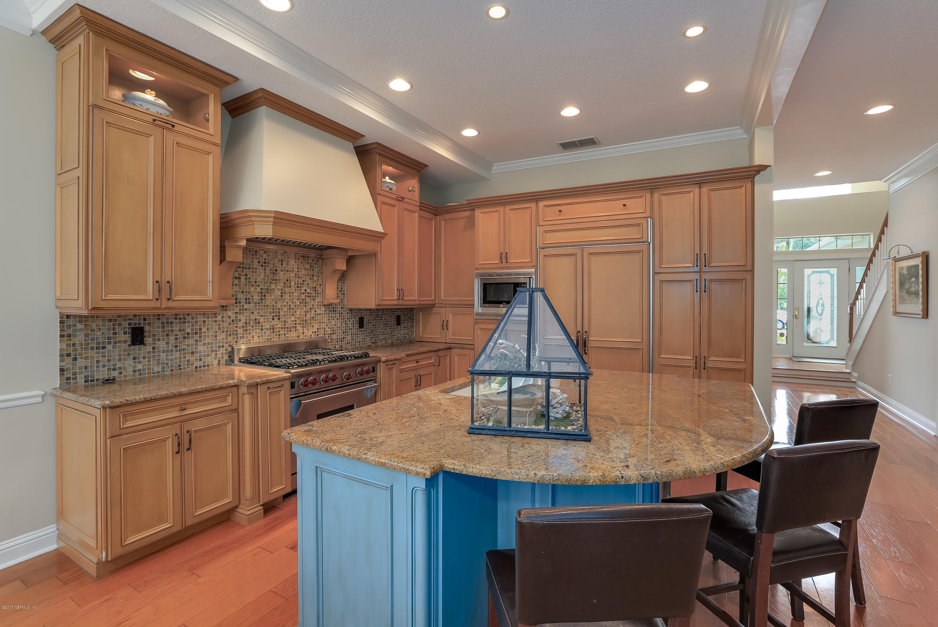 489 Big Tree Road Ponte Vedra Beach, FL 32082 - Photo 11 of 32 a kitchen with stainless steel appliances granite countertop a sink a stove and a refrigerator