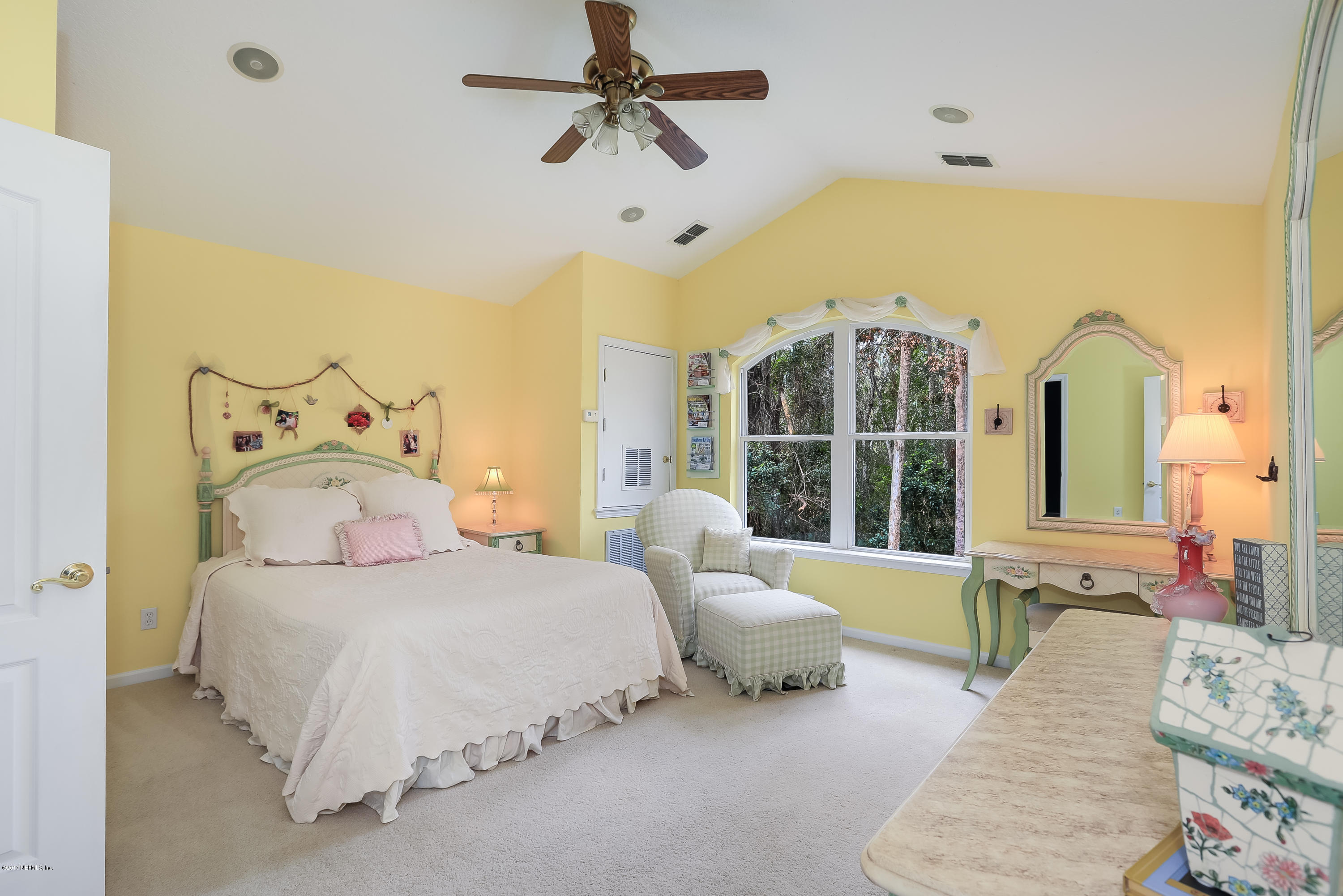489 Big Tree Road Ponte Vedra Beach, FL 32082 - Photo 19 of 32 a spacious bedroom with a bed and a large window