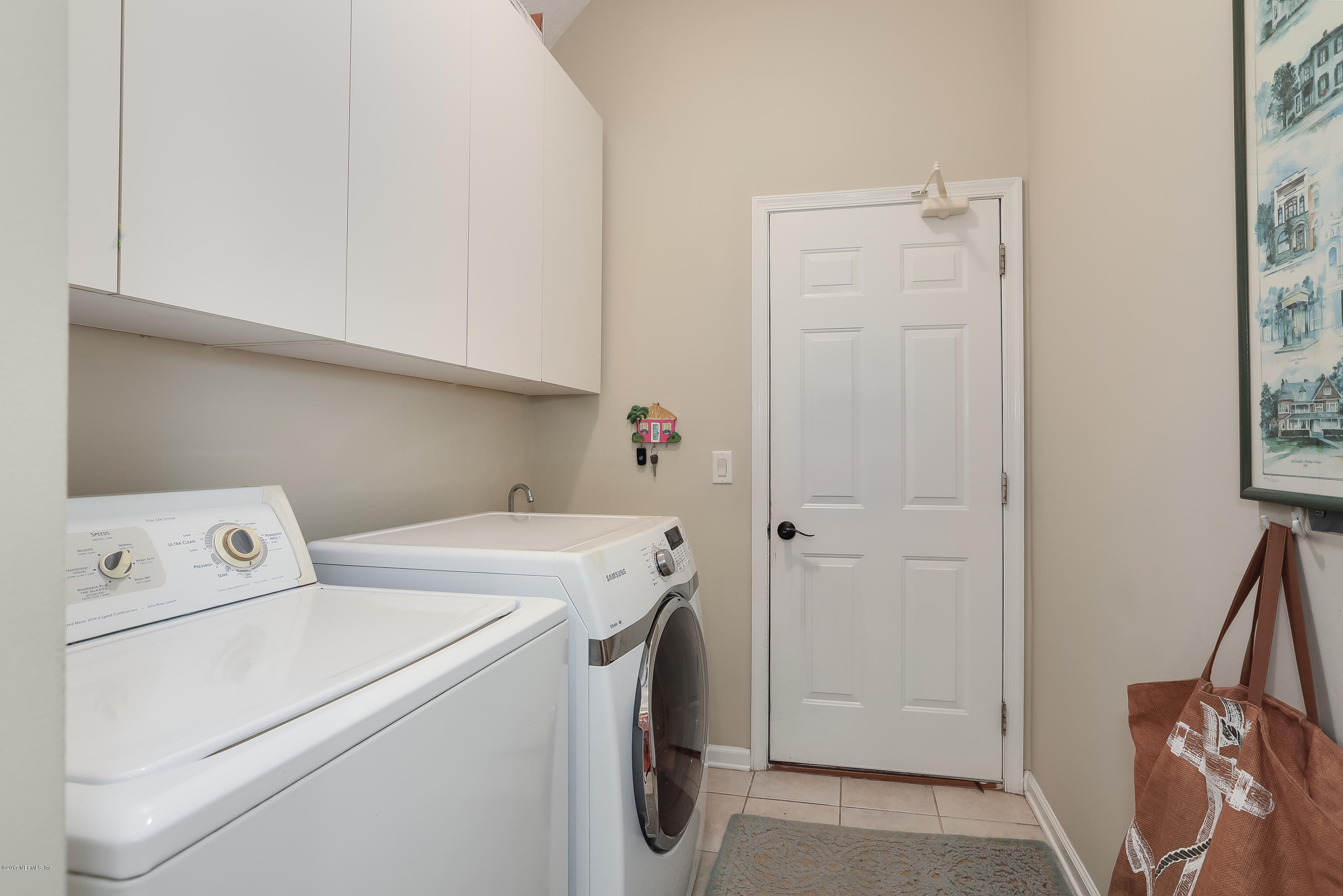 489 Big Tree Road Ponte Vedra Beach, FL 32082 - Photo 23 of 32 a utility room with dryer and washer