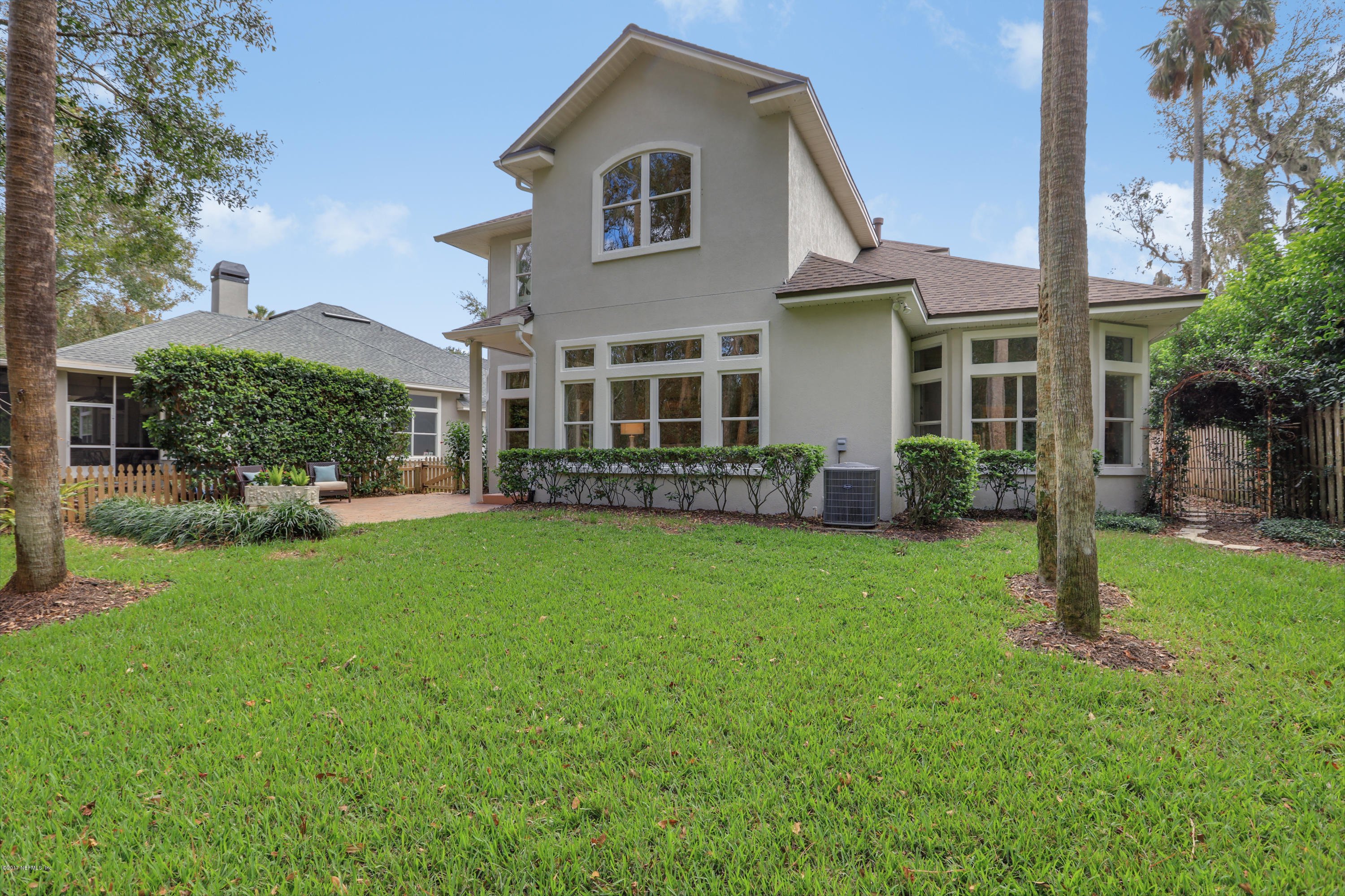 489 Big Tree Road Ponte Vedra Beach, FL 32082 - Photo 27 of 32 a front view of a house with a yard and green space