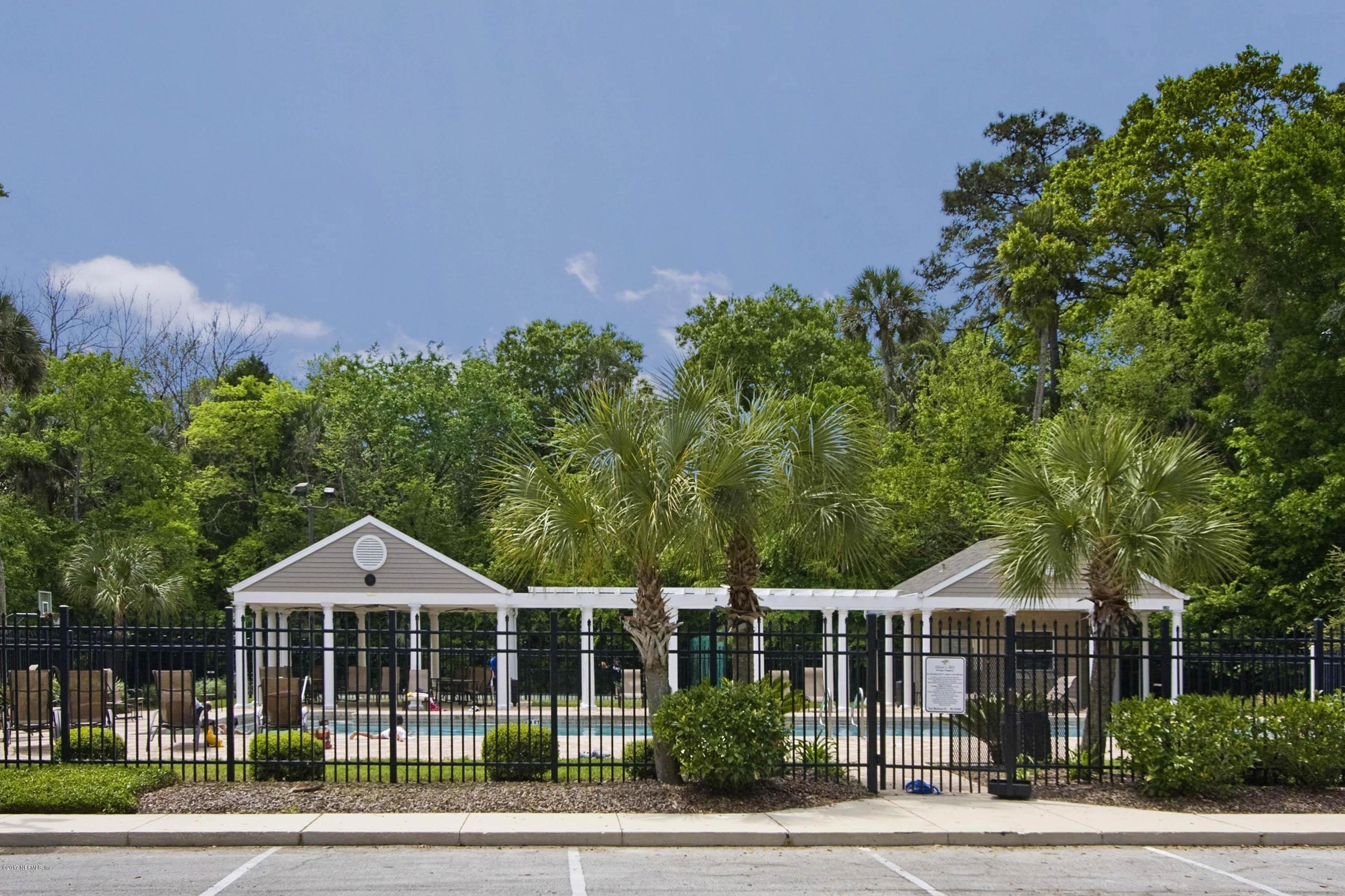 489 Big Tree Road Ponte Vedra Beach, FL 32082 - Photo 30 of 32 a front view of a house with a garden