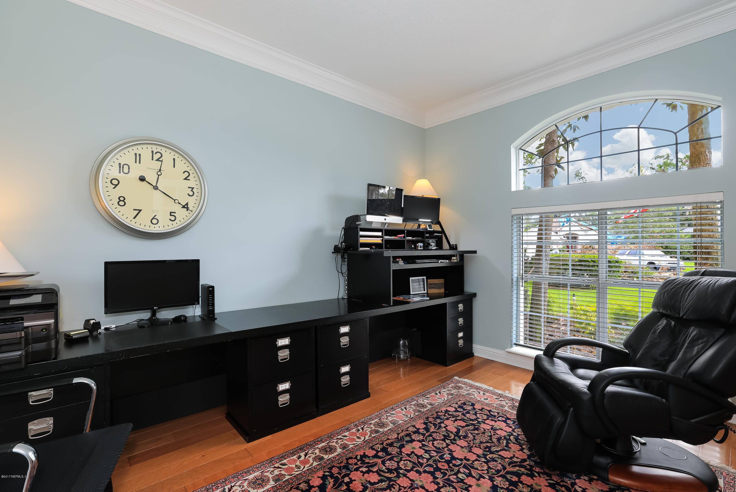 489 Big Tree Road Ponte Vedra Beach, FL 32082 - Photo 5 of 32 a living room with furniture a large window and a fireplace