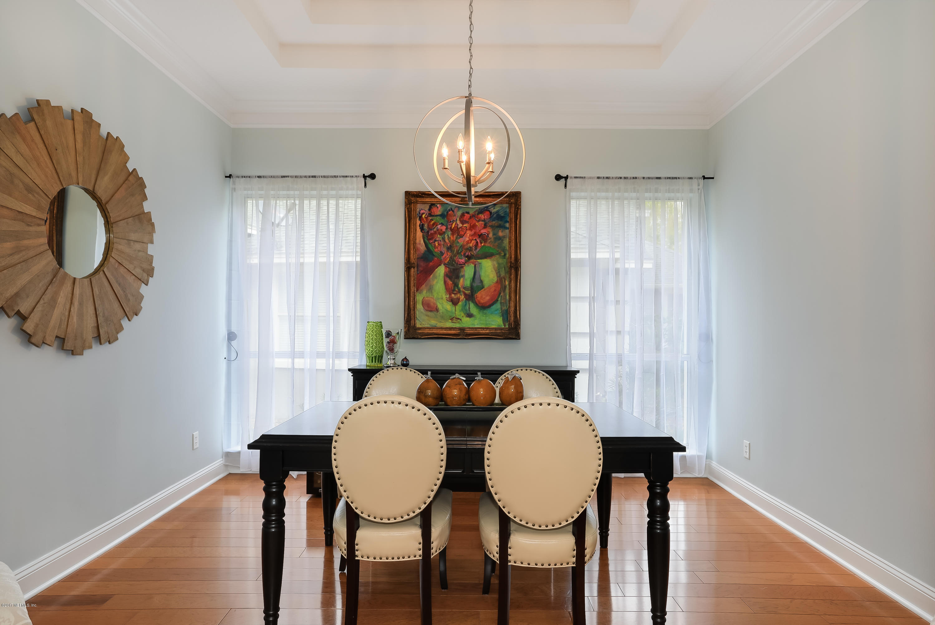 489 Big Tree Road Ponte Vedra Beach, FL 32082 - Photo 8 of 32 a view of a dining room with furniture wooden floor and chandelier