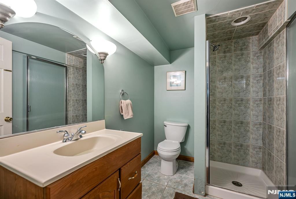 411 Snyder Road Wyckoff, NJ 07481 - Photo 32 of 36 a bathroom with a sink toilet and shower