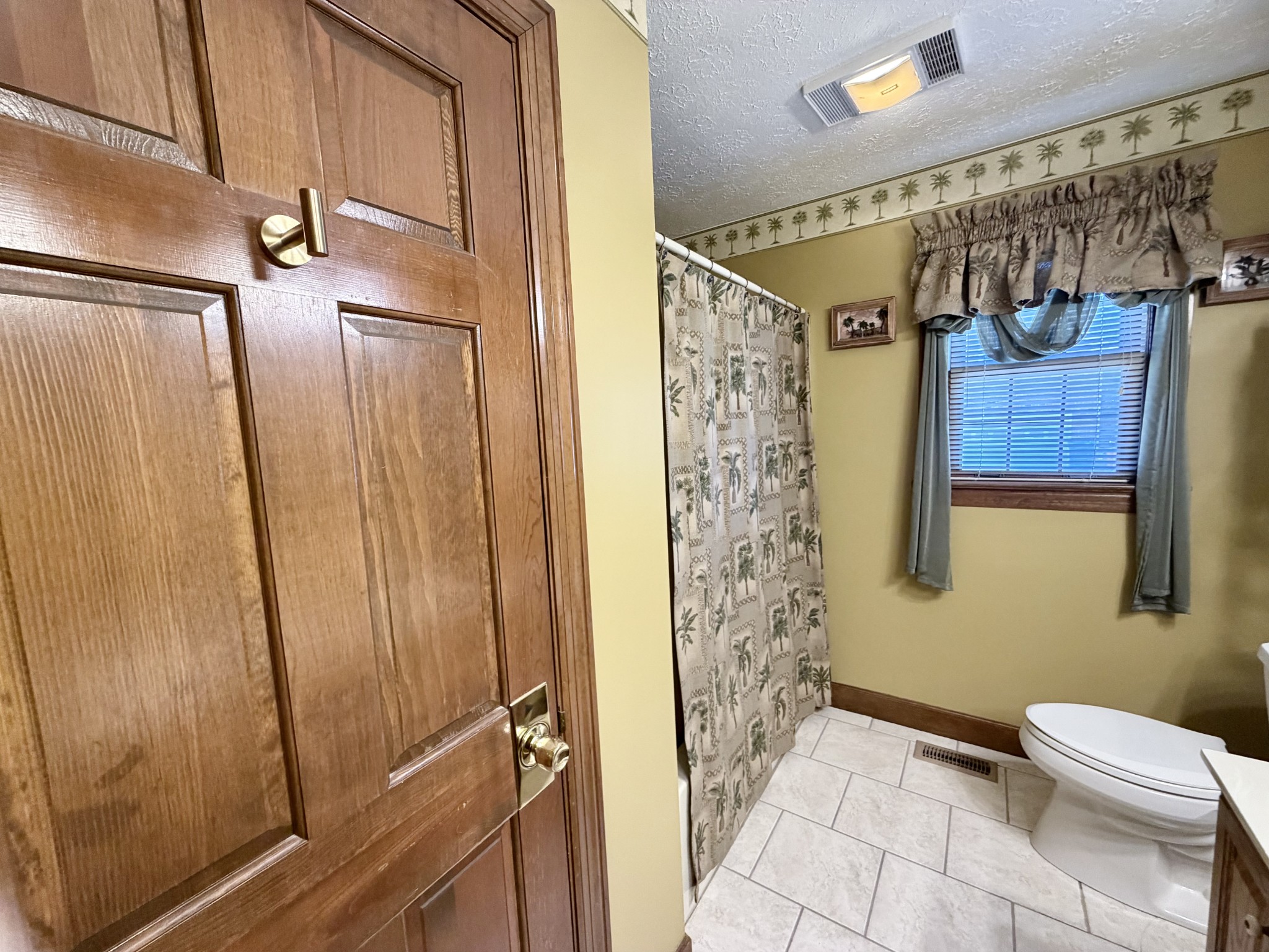 6914 Burkitt Road Antioch, TN 37013 - Photo 38 of 97 a bathroom with a shower and a toilet