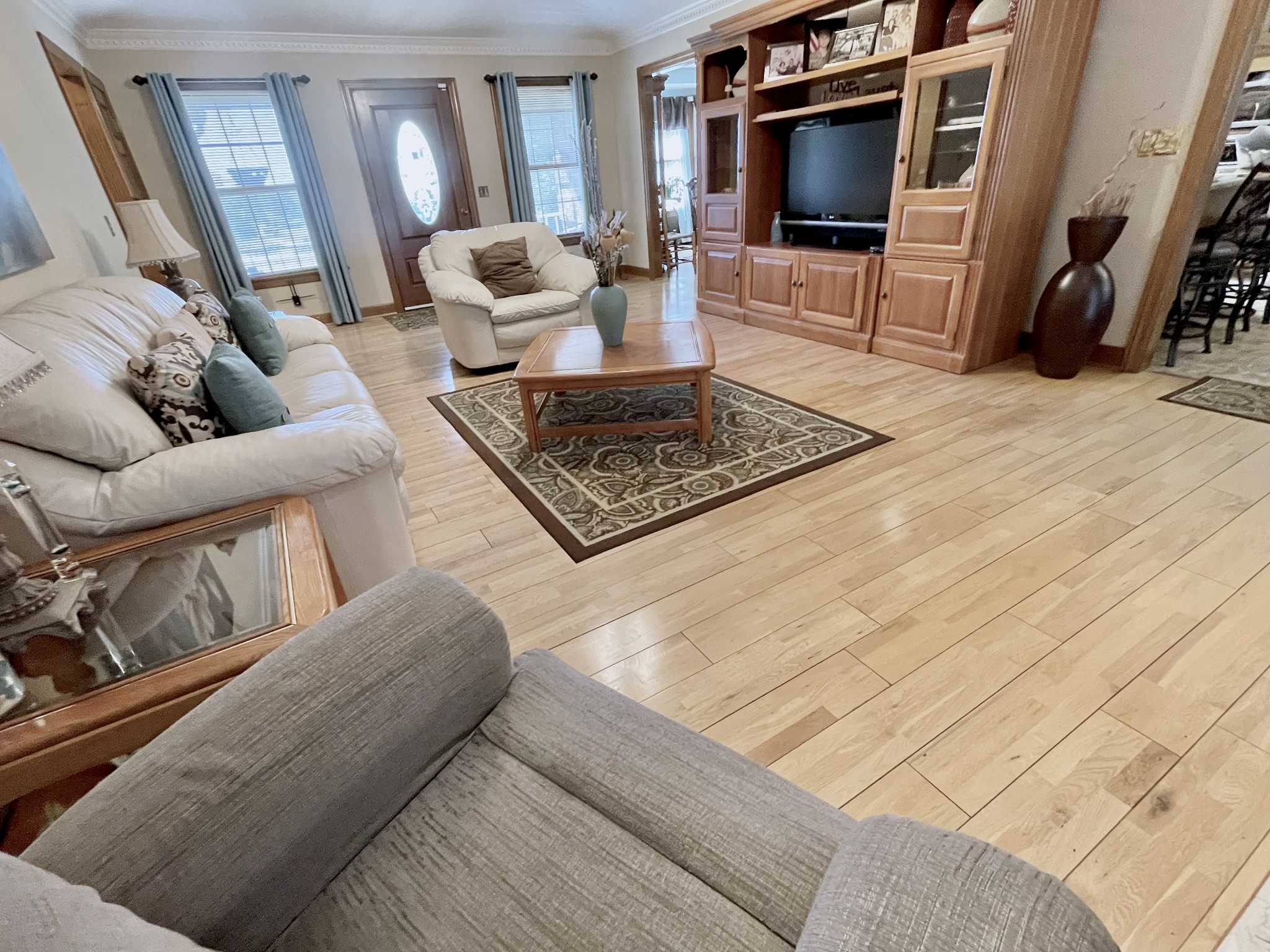6914 Burkitt Road Antioch, TN 37013 - Photo 9 of 97 a living room with furniture and a flat screen tv