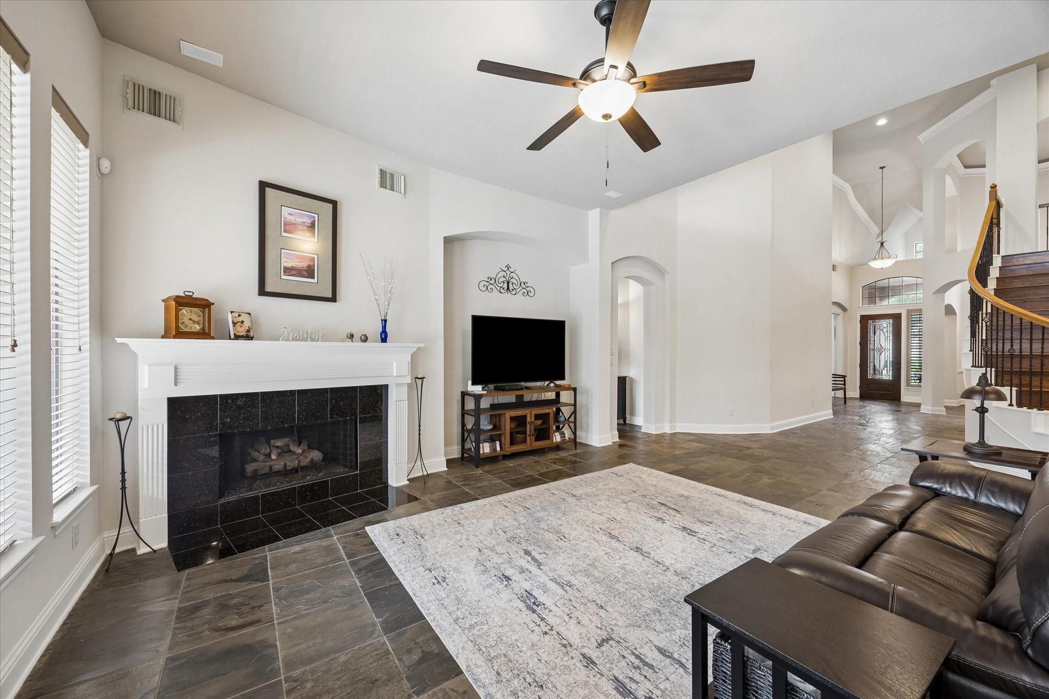 3902 Trailstone Lane Katy, TX 77494 - Photo 13 of 50 Anchored by a charming gas-log fireplace, this spacious family room offers the kind of comfort and openness that makes it easy to gather, relax, and stay awhile.